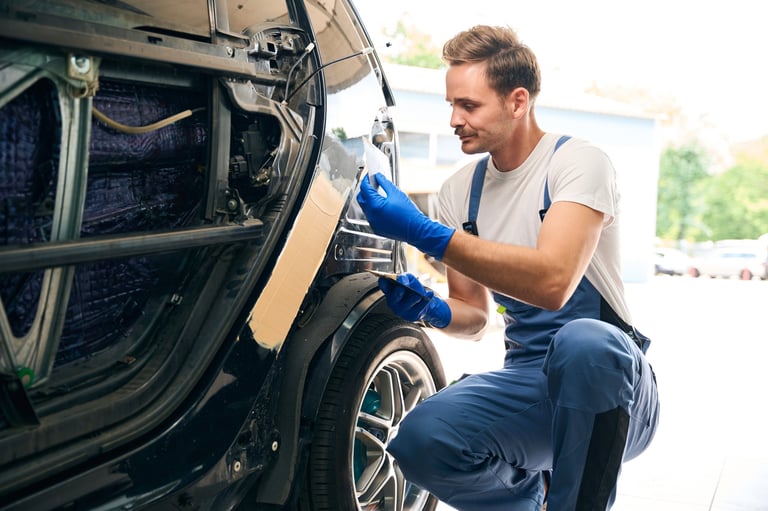 Professional auto body technician at work